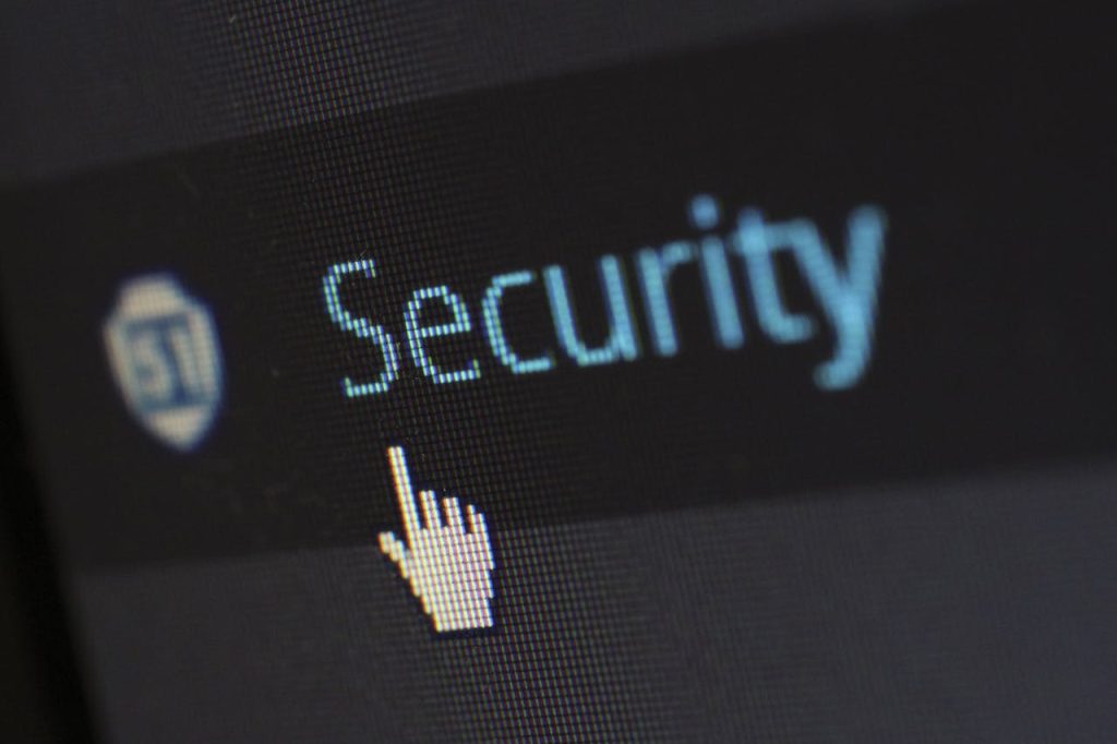 security-protection-anti-virus-software-60504 Close-up view of a mouse cursor over digital security text on display.